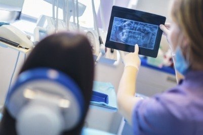 Doctor McGinn and dental office looking at digital x-rays