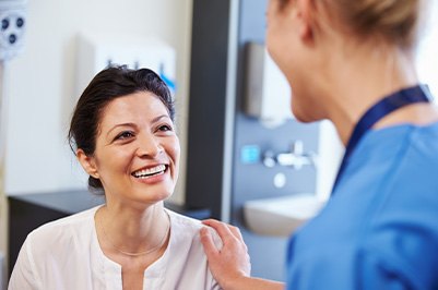 Dentures patient in Putnam smiling at dentist